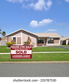 Real Estate Sold (another Success Let Us Help You Buy Sell Your Next Home) Sign Curbside Suburban Ranch House Residential Neighborhood Blue Sky Clouds USA