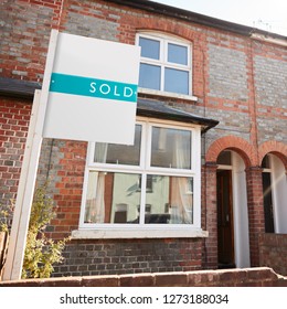 Real Estate Sold Board Outside Terraced House