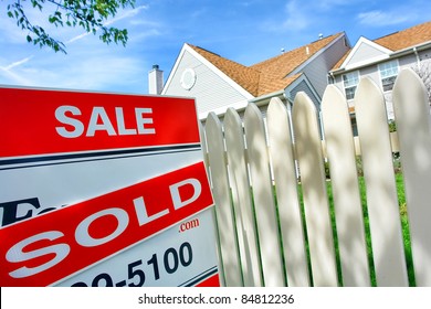 Real Estate Sold Insert On Realtor For Sale Sign And White Picket Fence At A Selling Suburban House After A Successful Resale Brokerage Transaction In The Residential Multiple Listing Service