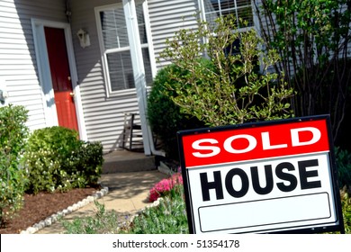 Real Estate Sold Rider Insert On A Realtor House For Sale Sign In The Front Yard Of A Resale Home Under Purchase Contract
