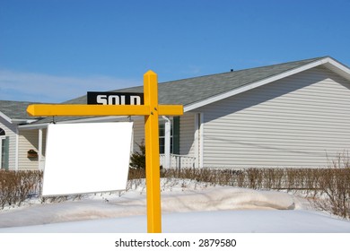 Real Estate Sold Sign In Front Of A New House.