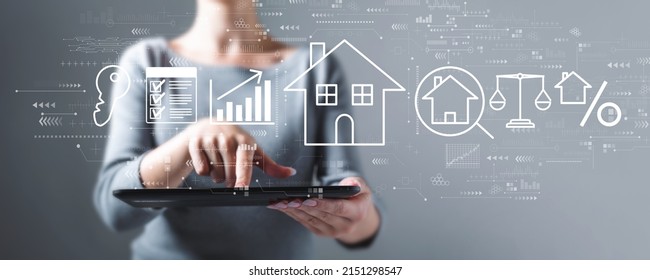 Real estate theme with business woman using a tablet computer - Powered by Shutterstock