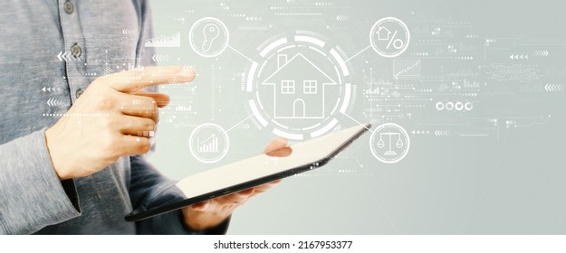 Real Estate Theme With Young Man Holding A Tablet Computer