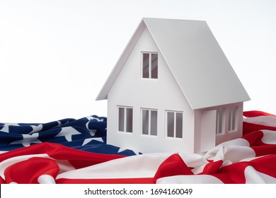 Ñoncept is real estate in the USA. Realtor in the United States. Rental housing in New York. Home for sale in the USA. Layout of the house next to the US flag. Life in the USA. Emigration to America