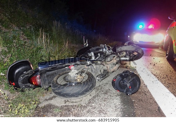 Real event, Motorcycle accident, crash at night on a\
wet road