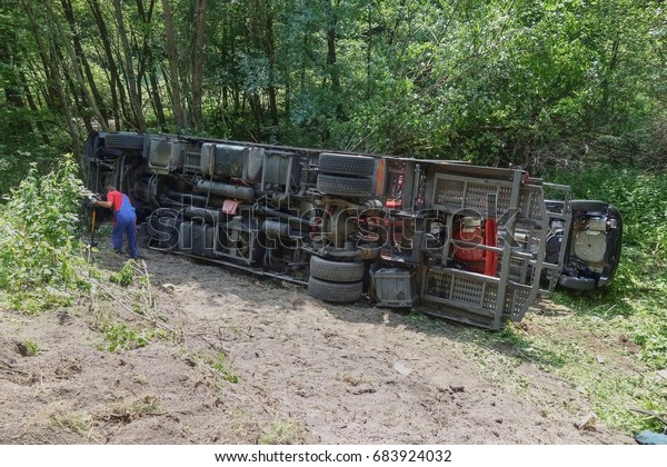 Real event, Truck\
accident. The truck crashed on the road and overturned. Carriage of\
new cars.