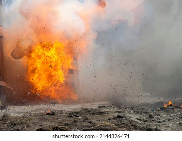 real explosion with fire smoke and dust in the street without people