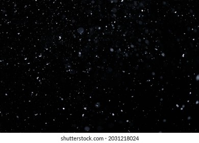 Real falling snow on black background for blending modes in ps. Ver 08 - few snowflakes in blur. - Shutterstock ID 2031218024