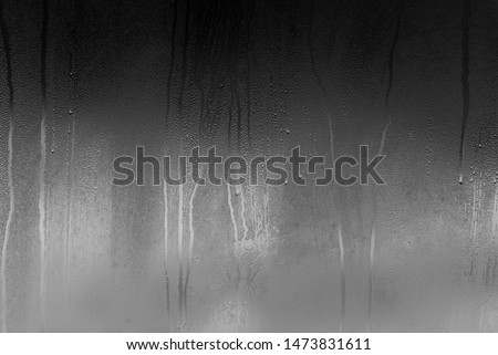 Real glass Window with steam and condensation on surface raining Night 