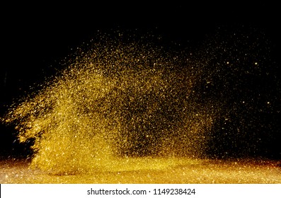 Real Gold Glitter Particles  Isolated On Black Background