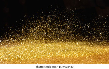 Real Gold Glitter Particles  Isolated On Black Background