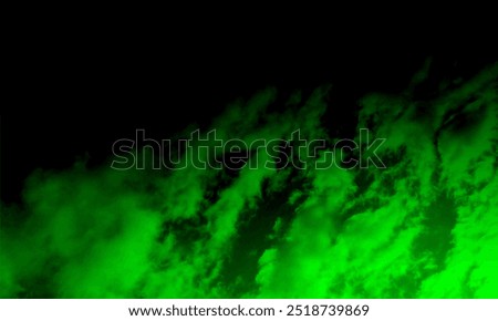 Real Green smoke exploding outwards with empty center.Dramatic smoke or fog effect for spooky Halloween background.Vivid and intense abstract background or wallpaper.Mystery dark background.