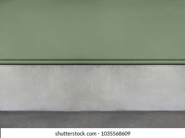 Real Grey Concrete Wall With Green Paper Limbo. Grunge Gray Background With Space For Text. Cement And Concrete Wall And Floor. Modern Loft Style Interior Background. Half Green Paper Limbo.