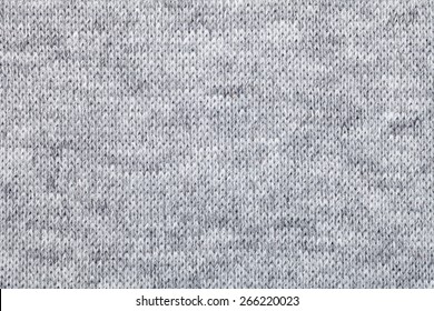 Real grey knitted fabric made of heathered yarn textured background - Shutterstock ID 266220023