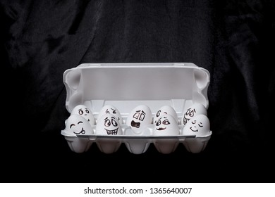  Real hand-painted eggs.  White eggs with faces drawn arranged in carton.Graffiti eggs in an egg box. Copy space. Black background.  - Powered by Shutterstock