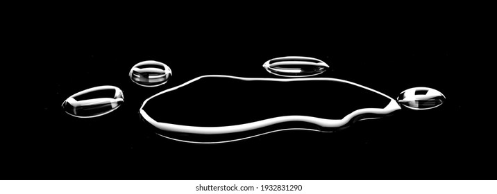 real image, spilled water drop on the floor isolated on black background.