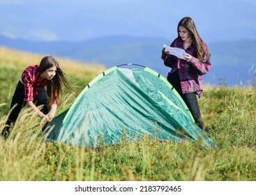 Real Joy. Two Girls Pitch Tent. Wanderlust Discovery. Hiking Outdoor Adventure. Friends Spend Free Time Together. Mountain Tourism Camp. Family Camping. Reach Destination Place