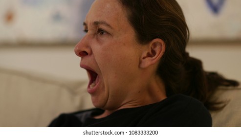 Real Life Candid Yawn. Woman Yawning Casually Late At Night