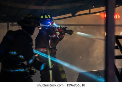 Real Life Hero, Strong And Brave Firefighter. Firemen On Duty, Quickly Extinguished The Blaze.