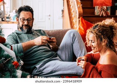 Real life leisure activity in chrismtas holiday at home for man and woman having breakfast together with italian coffee. Happiness and holiday celebration concept lifestyle. Couple in love indoor - Shutterstock ID 2396418909