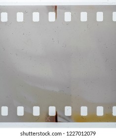 Real macro photo of 35mm film material on white, grungy texture or background