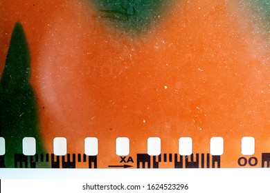 real macro photo of exposed 35mm film material with light leaks or sunstrokes, negative film strip template, color 135 type.