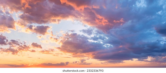 Real majestic sunrise sundown sky background with gentle colorful clouds without birds. Panoramic, big size - Shutterstock ID 2332336793