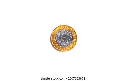 Real, Money from Brazil. A one Real coin isolated on white background. Finance and brazilian economy concepts.