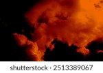 Real orange smoke exploding outwards with empty center.Dramatic smoke or fog effect for spooky Halloween background.Fog or smoke on dark copy space background.Vivid and intense abstract background.