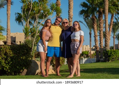 Real People Concept, Beautiful Family, Two Teenage Girls, Mother And Father Happiness And Nice Body For Enjoyed People Live An Lifestyle, Smile And Walk Together In Vacation.