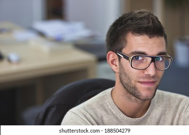 Real People - Portrait Of A Smart An Handsome Young Man In Office With Available Light