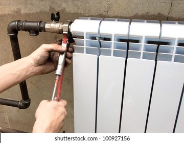 real photo of installation of a radiator