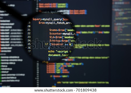 Real Php code developing screen. Programing workflow abstract algorithm concept. Lines of Php code visible under magnifying lens.