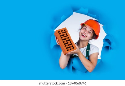 Real Professional. Kid Wear Helmet On Construction Site. Teen Girl Builder With Building Brick. Bricklayer Child On Repairing Work. Concept Of Renovation In Workshop. Busy Professional Carpenter.