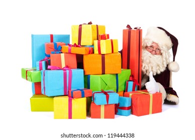 The Real Santa Claus With A Big Pile Of Colorful Presents