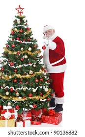 Real Santa Claus Holding Christmas Ball And Decorating  Christmas Tree, Isolated On White Background