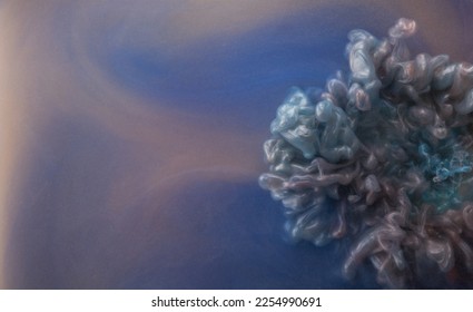 Real shot color paint drops in water. Abstract purple Ink cloud collision isolated on blue background. Liquid marble pattern. Modern art. Abstract fluid acrylic painting. - Shutterstock ID 2254990691
