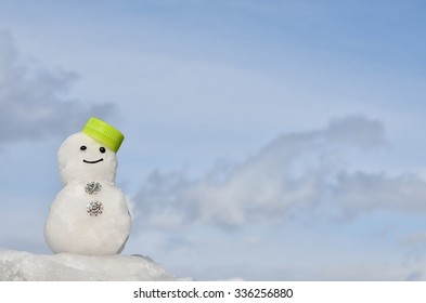 Real Snowman On A Blue Sky Background
