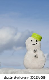 Real Snowman On A Blue Sky Background
