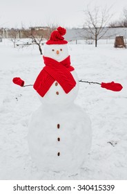 Real Snowman Outdoors In Winter White Scenery.