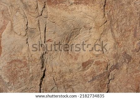 Real stone background with natural sand patterns. Stone background with scratches and patterns.