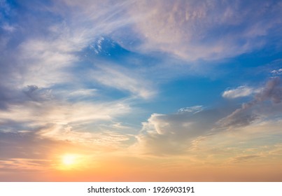Real sundown sunset  sky with beautiful light clouds and sun, wothout any birds. Huge resolutions - Shutterstock ID 1926903191