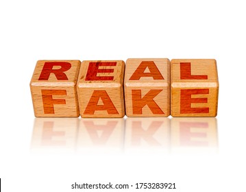 Real Versus Fake Concept With Wooden Cubes Isolated On Reflective White Background.