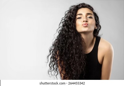 Real Woman With Beauty Black Hair Gives A Kiss