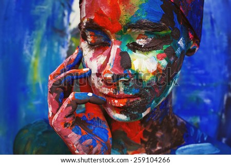 real woman painted upon her face imitating the oil painting
