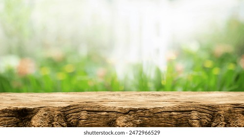 Real wood table top texture on blur flower garden background.beautiful nature and product placement design