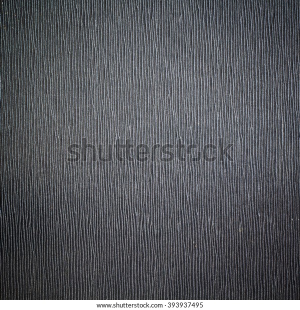 A
realistic dark carbon fiber weave background or
texture