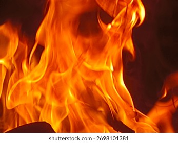 Realistic fire flame background

High-resolution photograph of real fire flames captured in vivid orange and yellow tones against a dark background. The image displays natural movement and texture