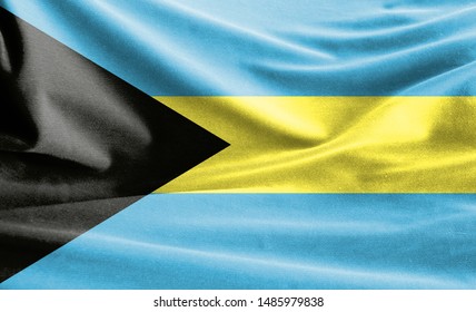 Realistic flag of Bahamas on the wavy surface of fabric