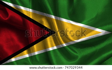 Realistic flag of Guyana on the wavy surface of fabric. This flag can be used in design.